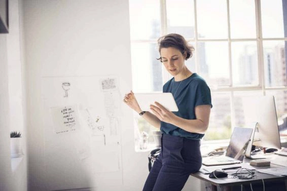 Businesswoman using digital tablet in office