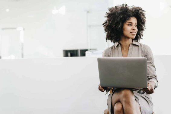 Young woman using laptop in office